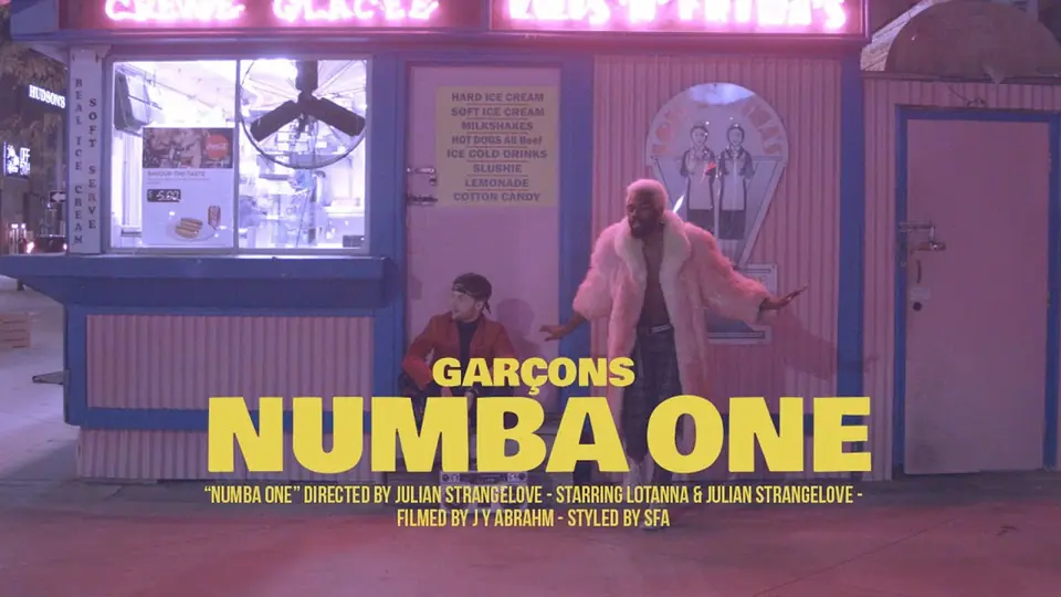Still from the Numba One video